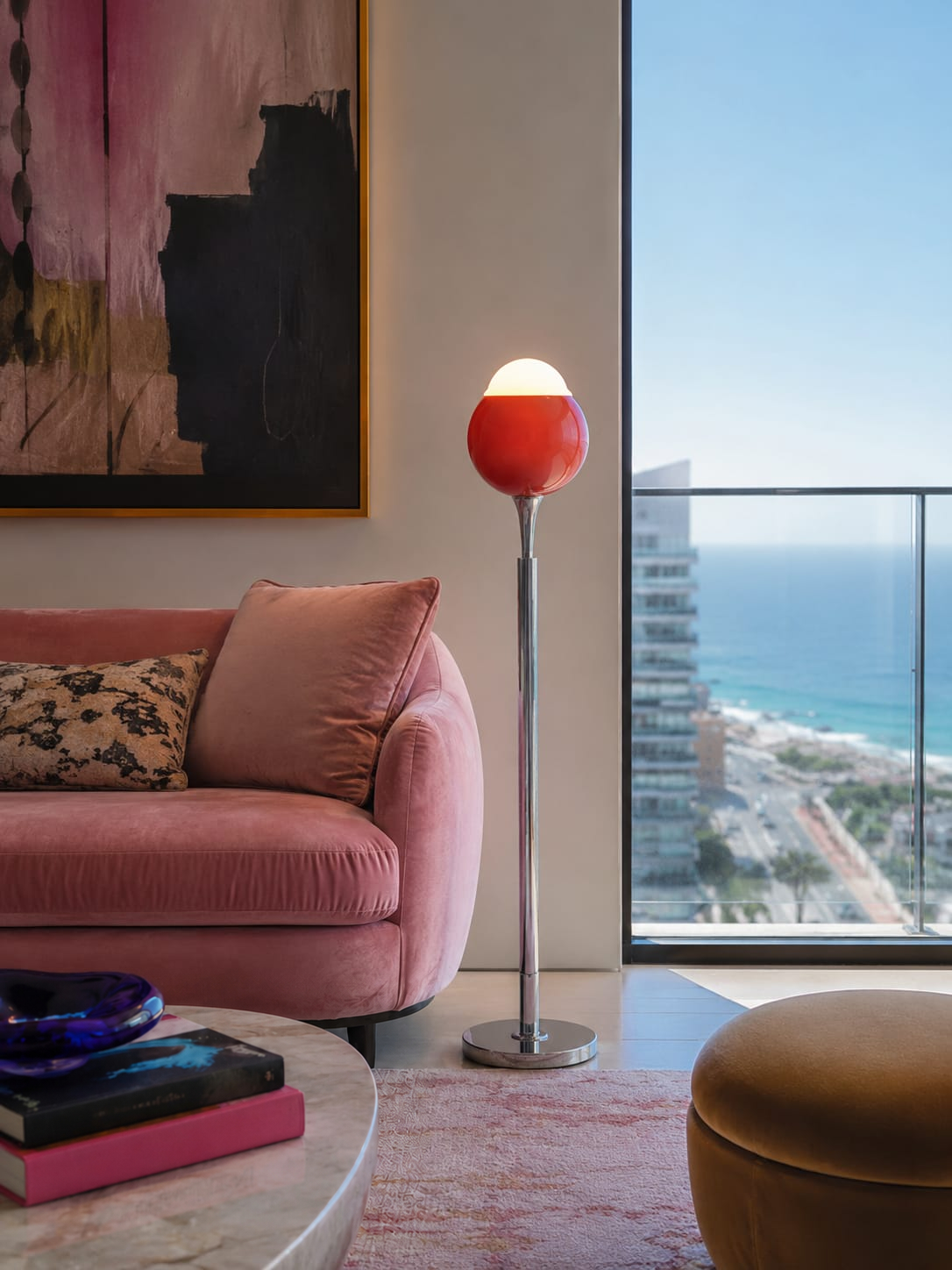 No. 001, Ember, a tall floor lamp with a glowing white dome, red rounded shade, slender reflective stem, and circular base.