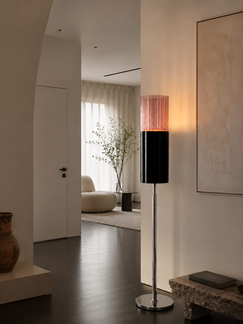 No. 013, Blush, a tall floor lamp with a glowing pink ribbed upper cylinder, dark lower cylinder, narrow reflective stem, and round base.