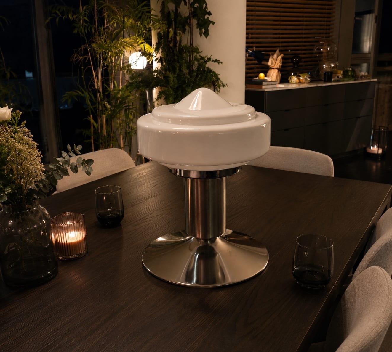 No. 039, Saucer, a domed shade with a pointed cap glows above a low chrome pedestal.