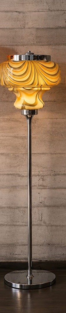 No. 041, Saffron, a ribbed gold glass shade rises on a slim chrome pole above a round base.