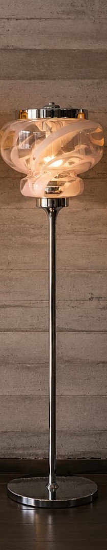 No. 042, Frost, a white, spiral-patterned glass shade sits atop a slim chrome pole and round base.